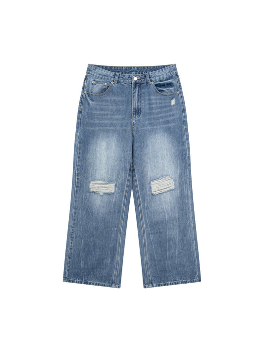 Light blue denim jeans with a straight-leg fit, featuring distressed rips on both thighs and a small white embroidered logo on the upper right hip, displayed flat against a white background.