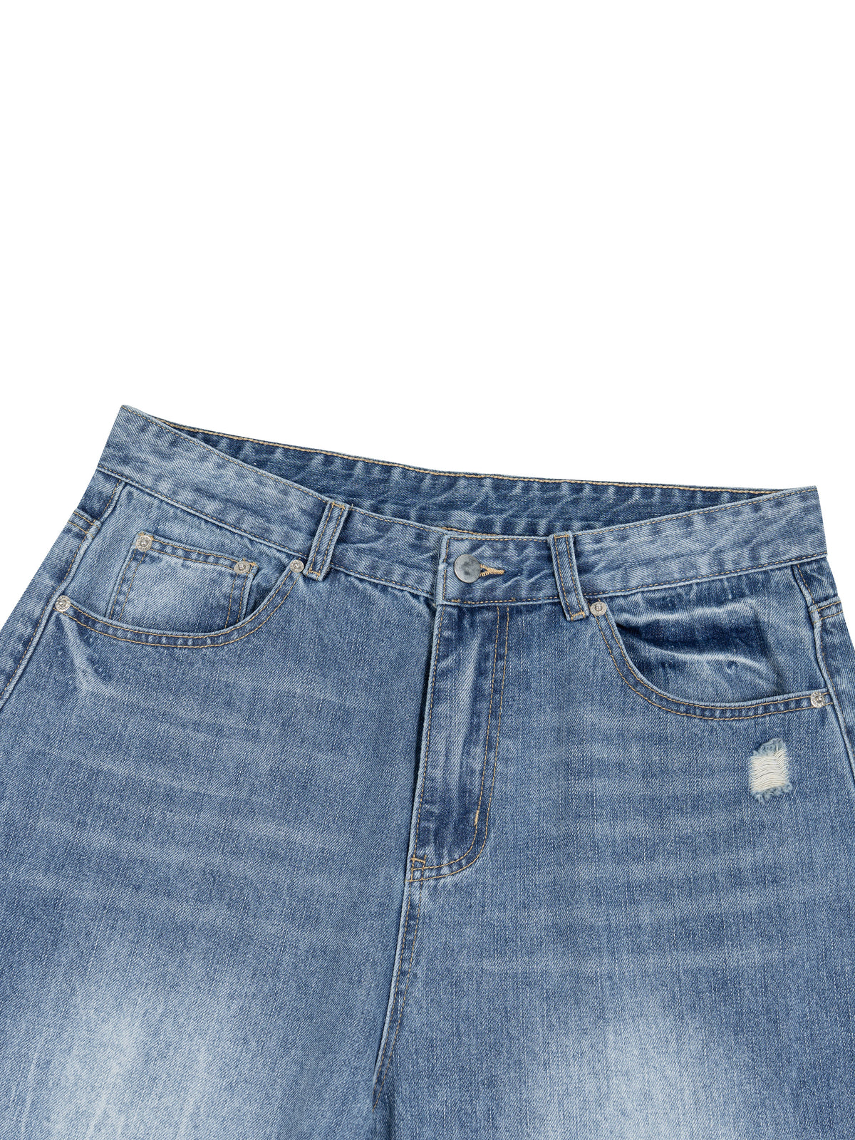 Close-up of the waistband and front pockets of blue denim jeans on a plain white background.