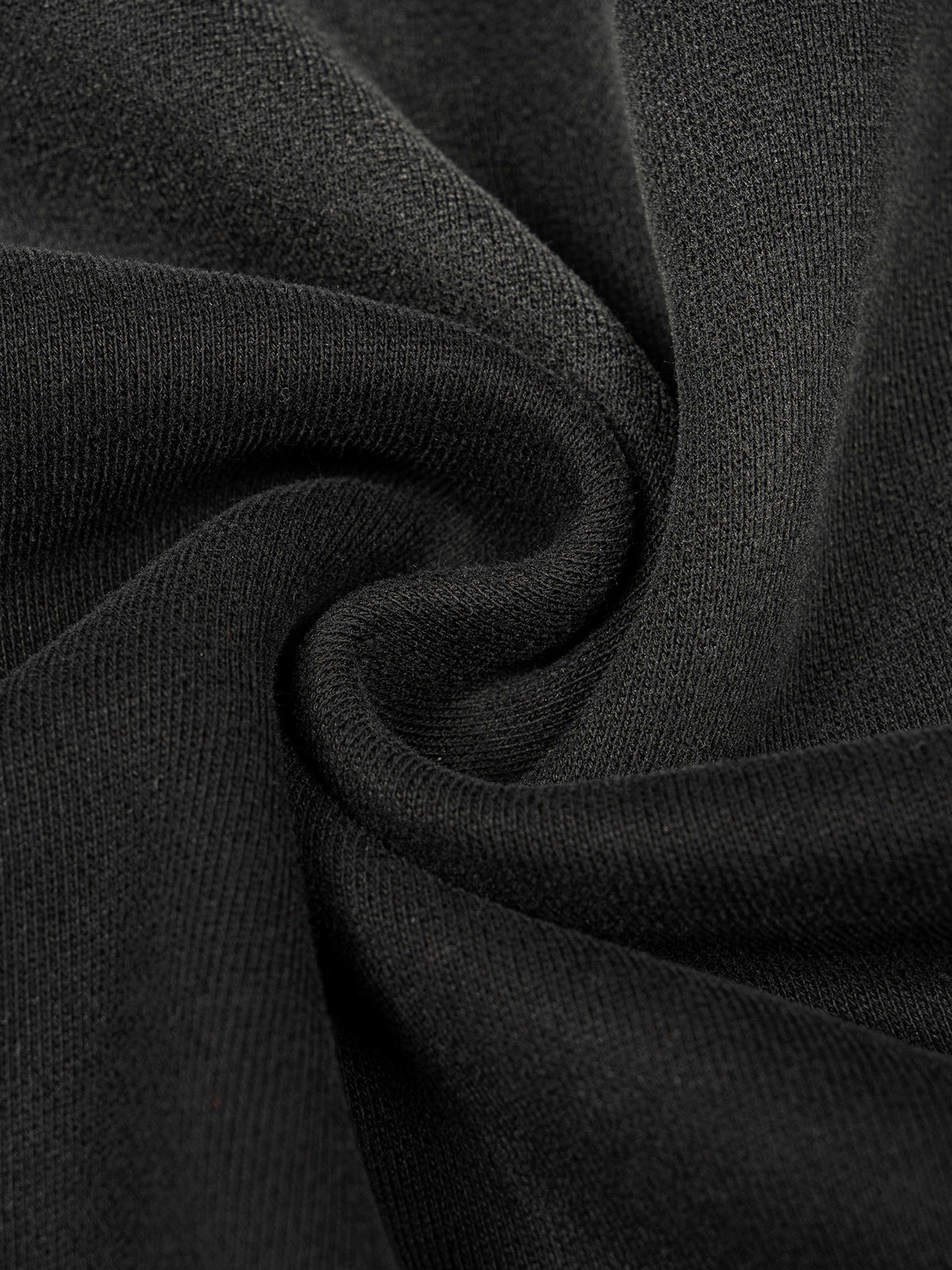 Close-up of black fabric with folds
