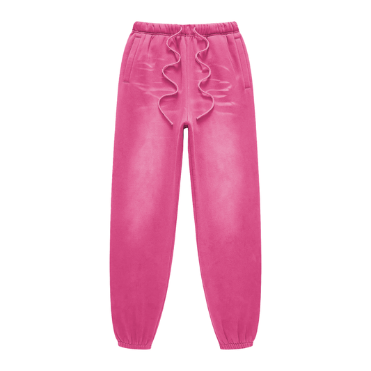 Pink velvet jogger pants with ruffled drawstring on a white background