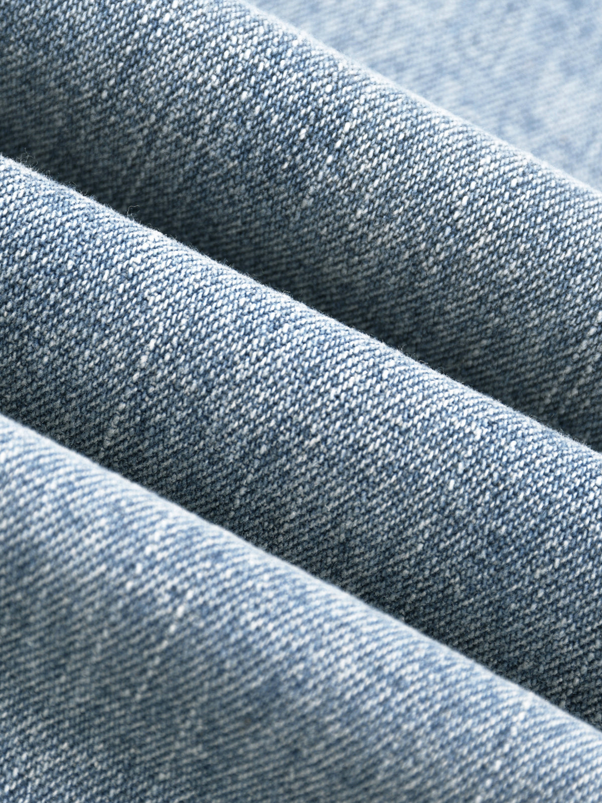 Close-up of denim fabric with a subtle pattern