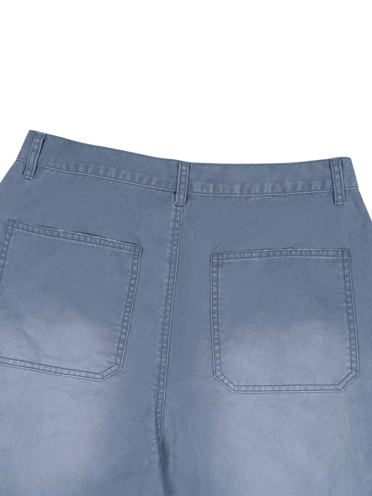 Close-up back view of light blue denim jeans showing the waistband, belt loops, and two rear patch pockets on a white background.