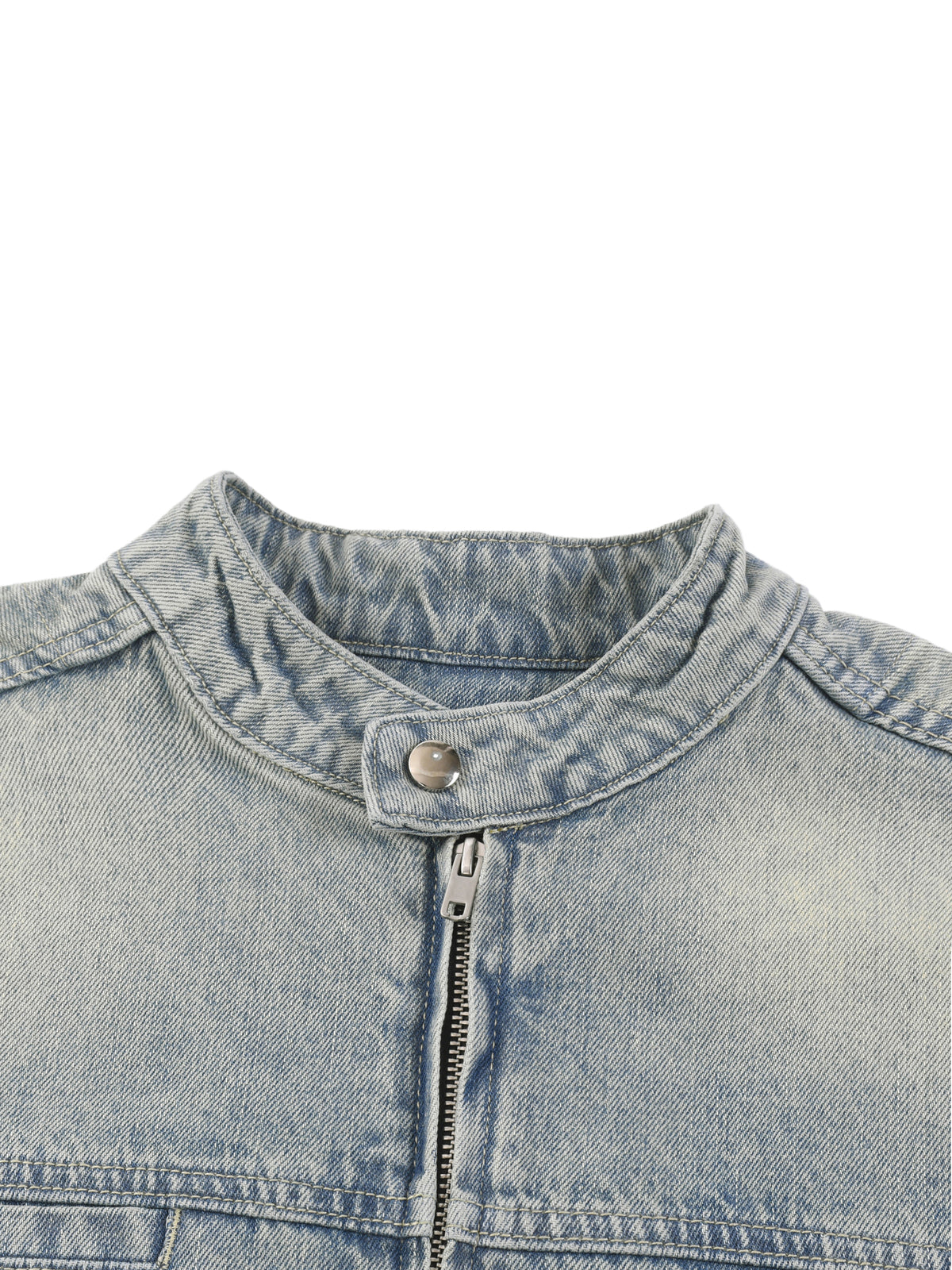 Close-up of a denim jacket collar with zipper on a white background
