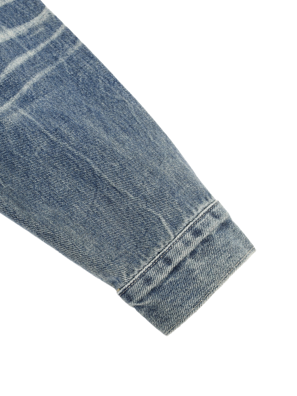 Close-up of a blue denim fabric with a white background