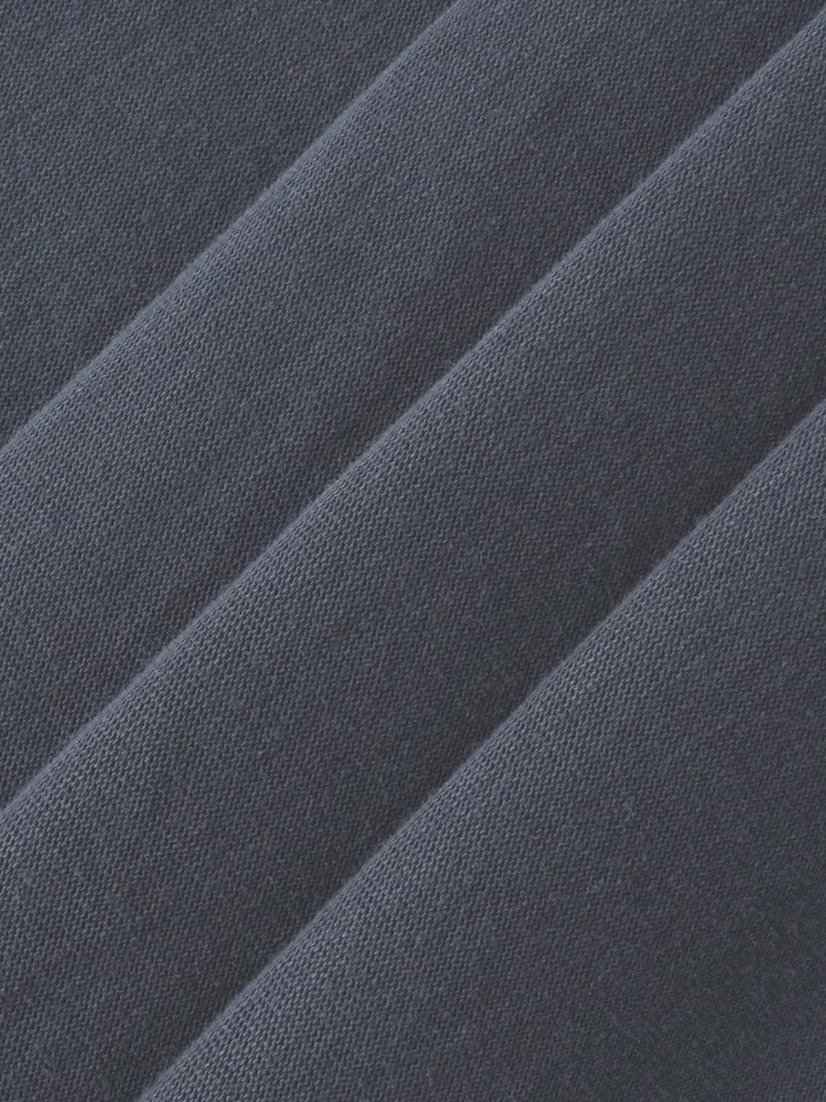 Close-up of dark gray fabric with a textured pattern