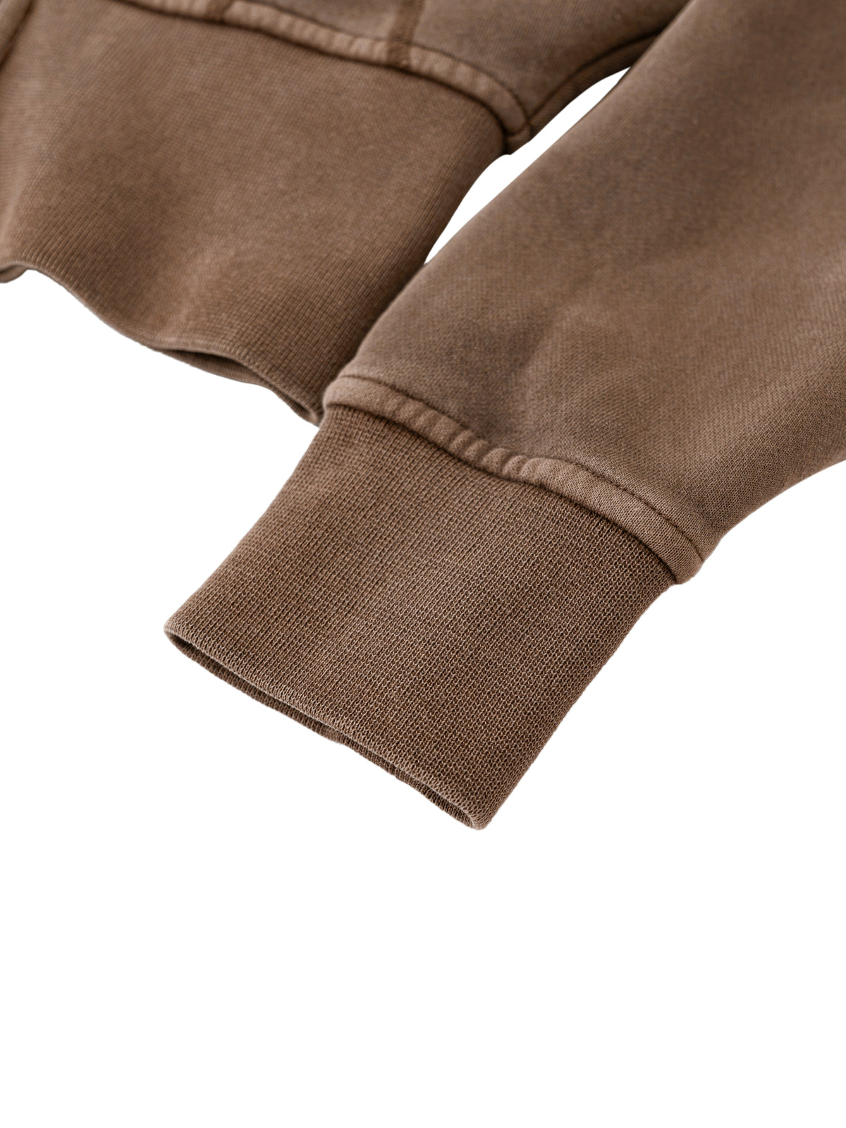 Close-up of brown sweatshirt cuffs on a white background