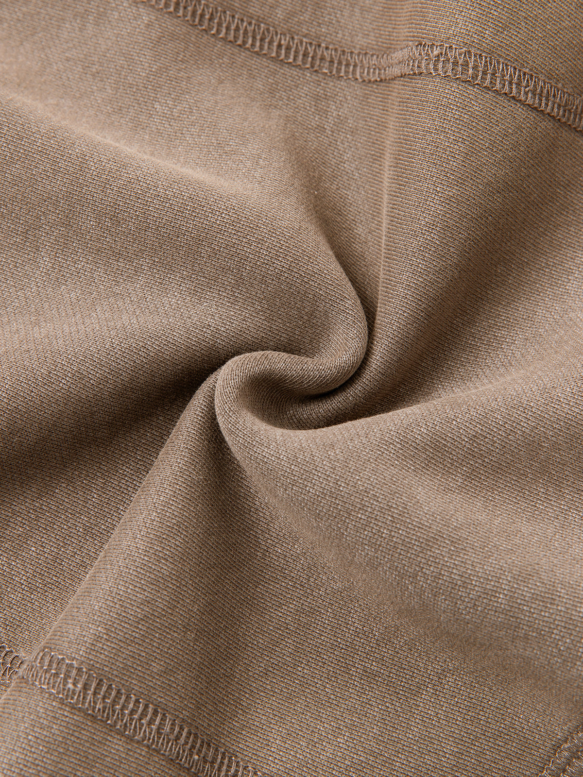 Close-up of beige fabric with stitching details