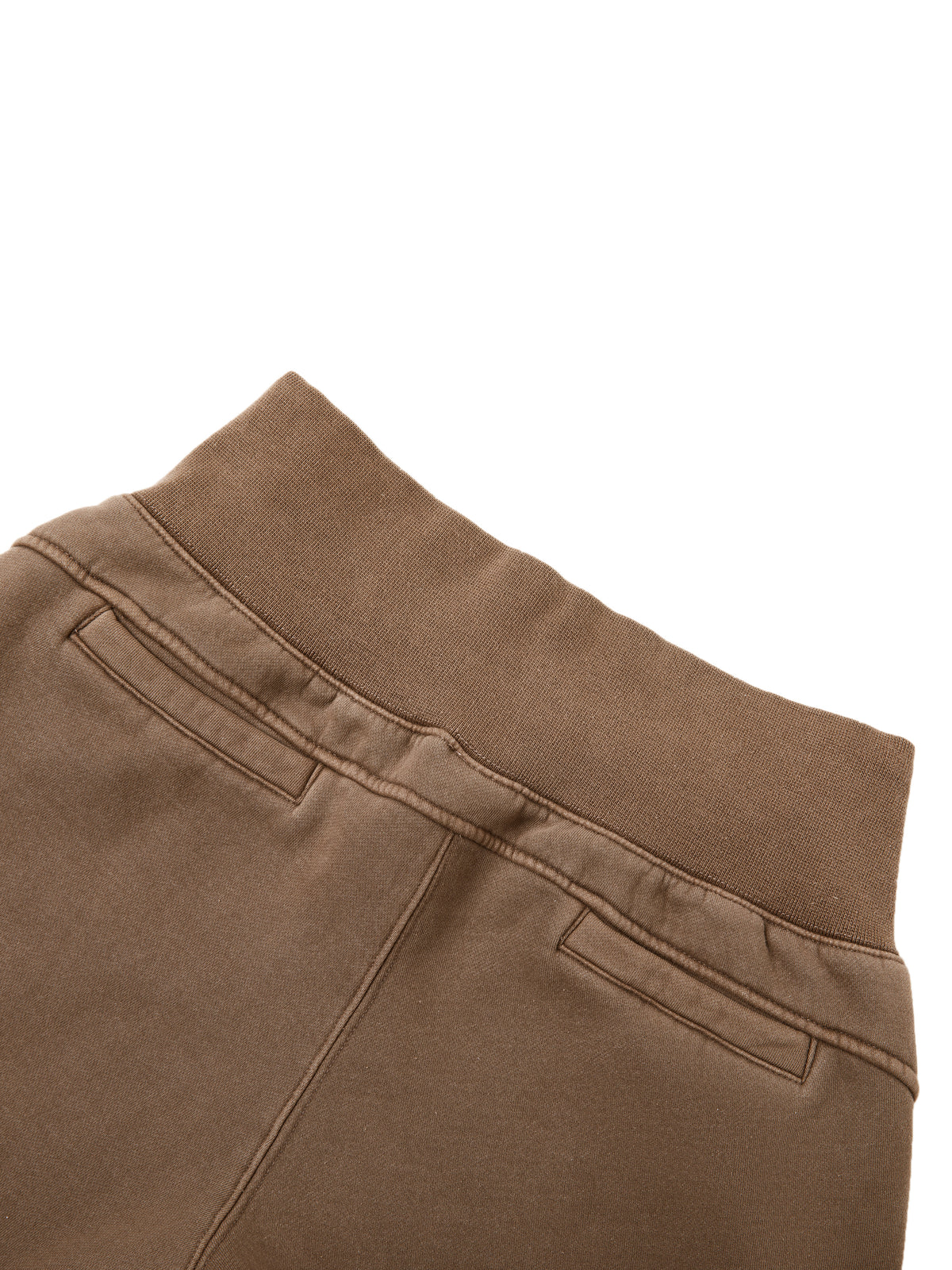 Close-up of brown pants on a white background