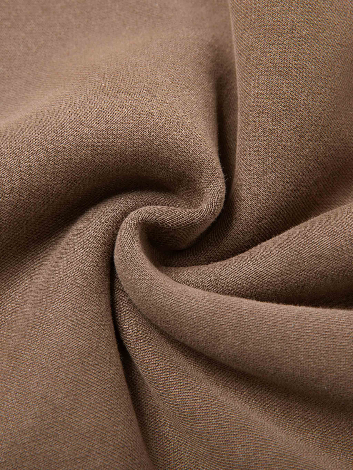 Close-up of brown fabric with folds