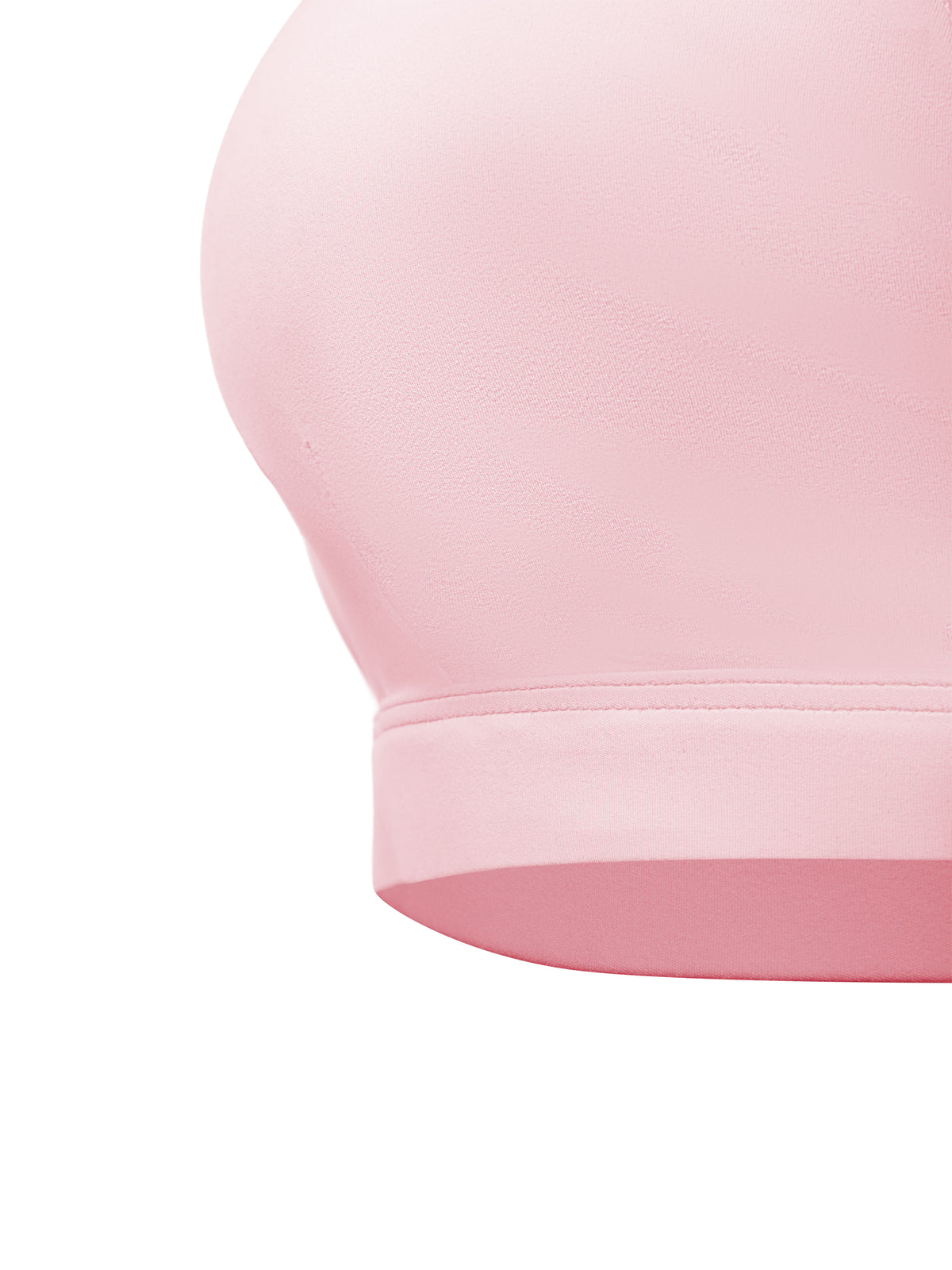 Close-up of a light pink seamless bra cup and underband on a plain white background.
