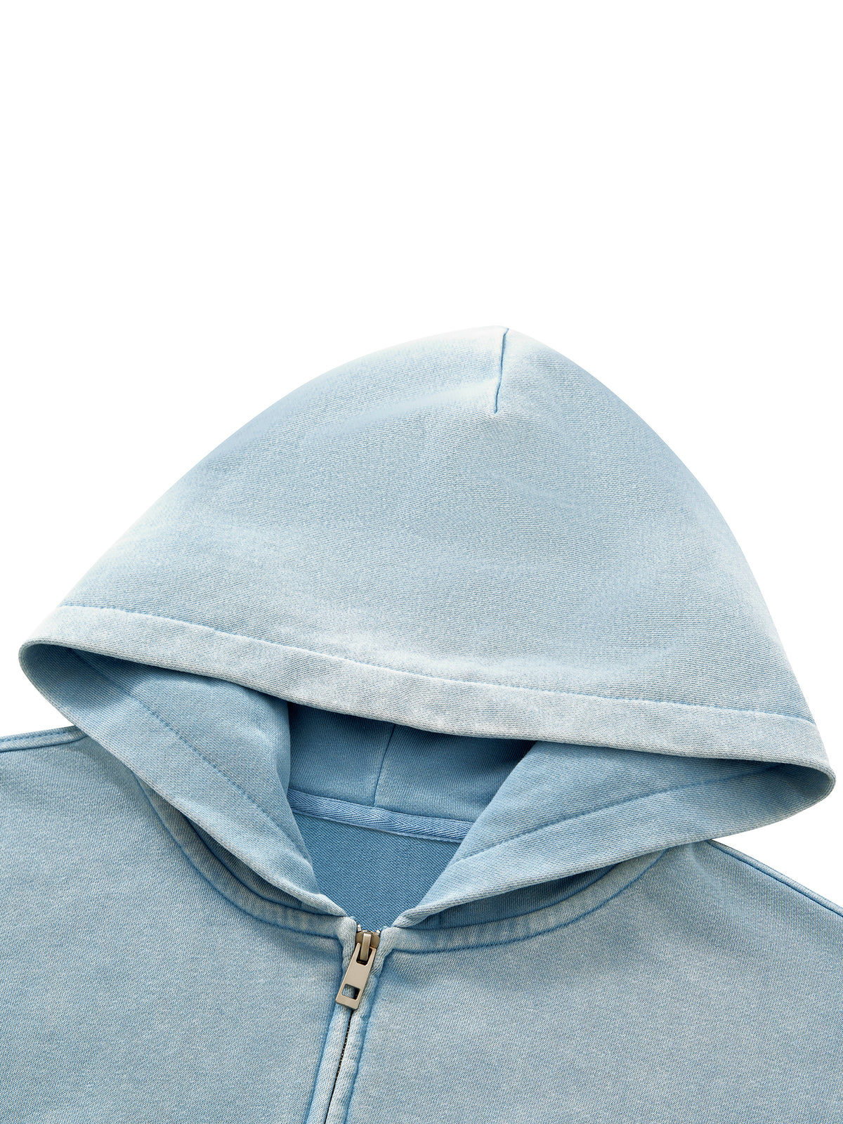 Close-up of a light blue zip-up hoodie showing the hood, ribbed collar, and a small metallic zipper pull against a plain white background.