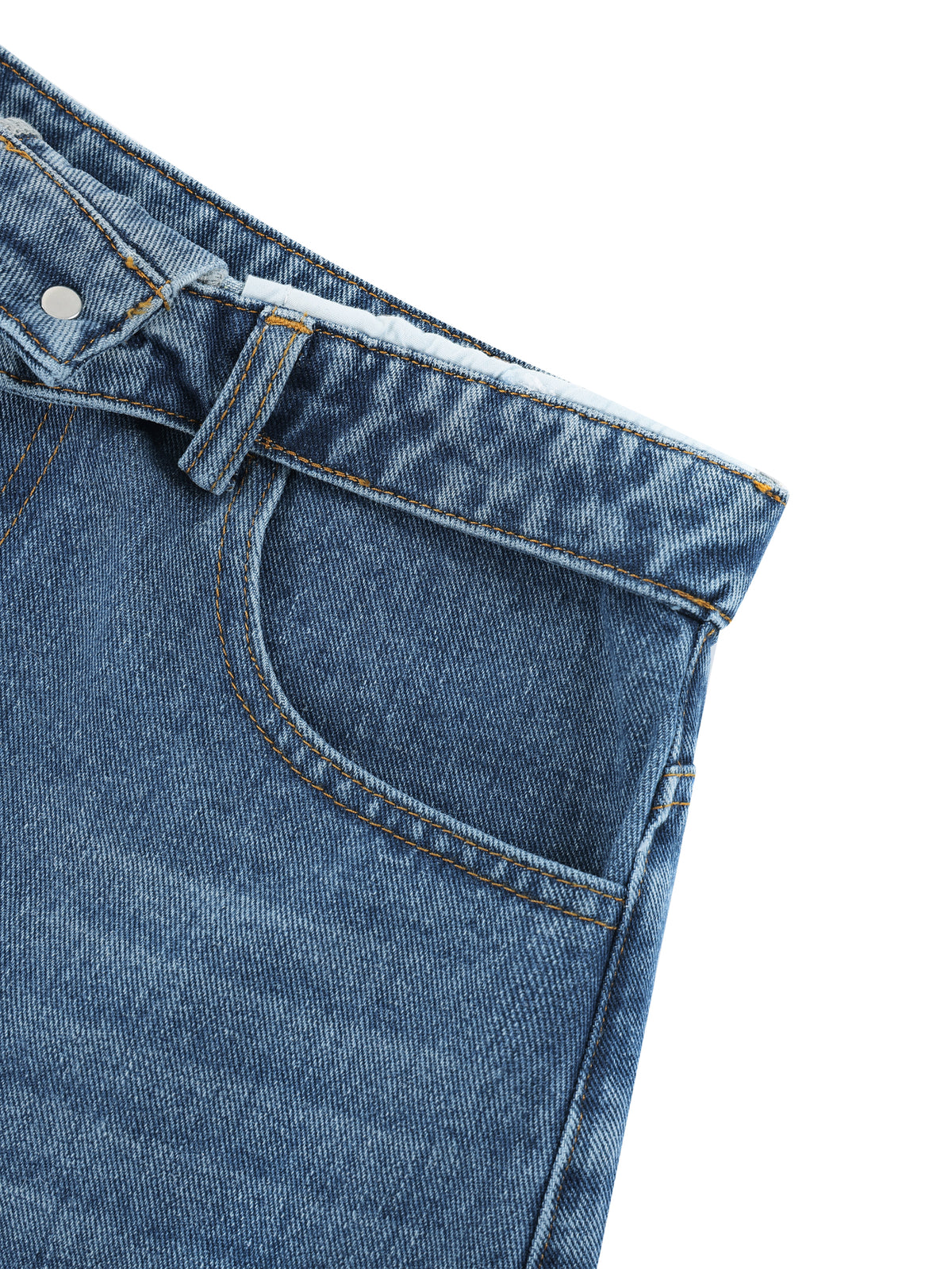 Close-up of blue denim jeans on a white background