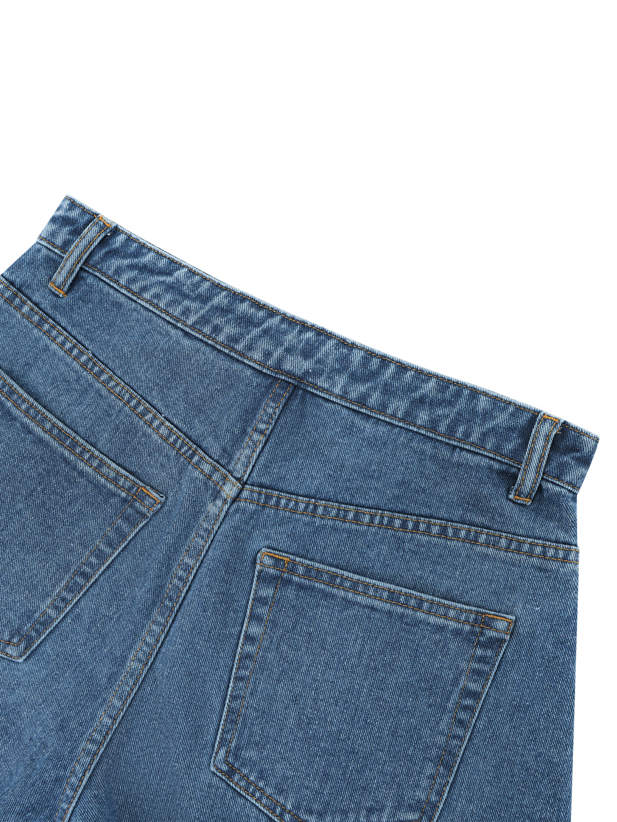 Close-up of blue denim jeans on a white background
